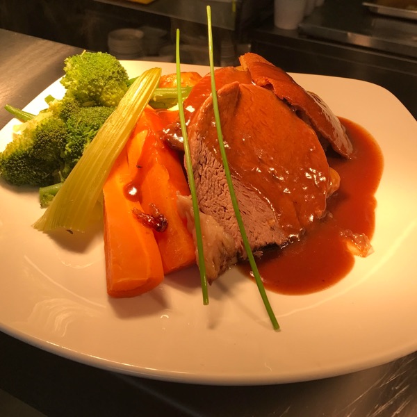 Roast beef with gravy, carrots, celery and broccoli